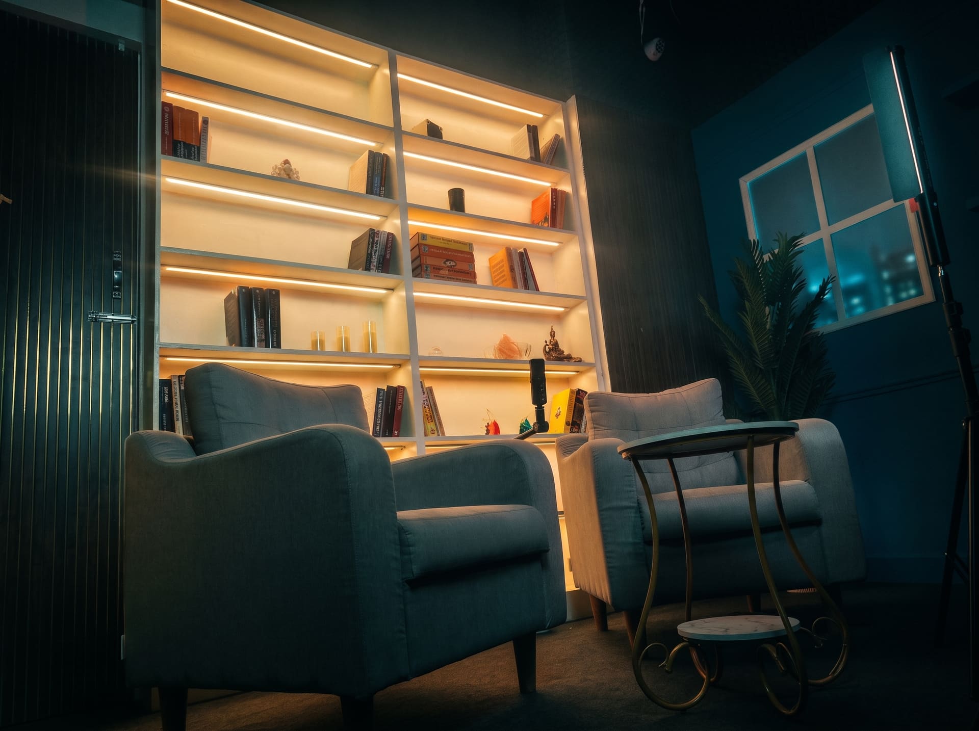 Chairs and ambient bookshelf, evening look